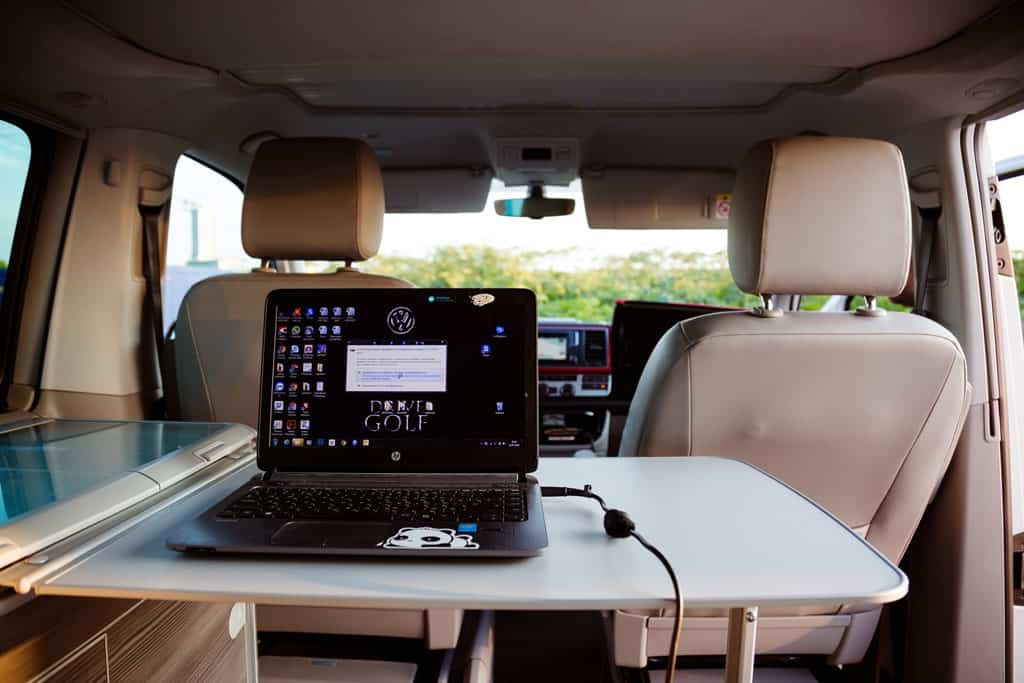 desk in campervan with laptop