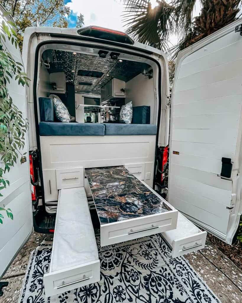 Back of van with a pull out table and pull out bench seats