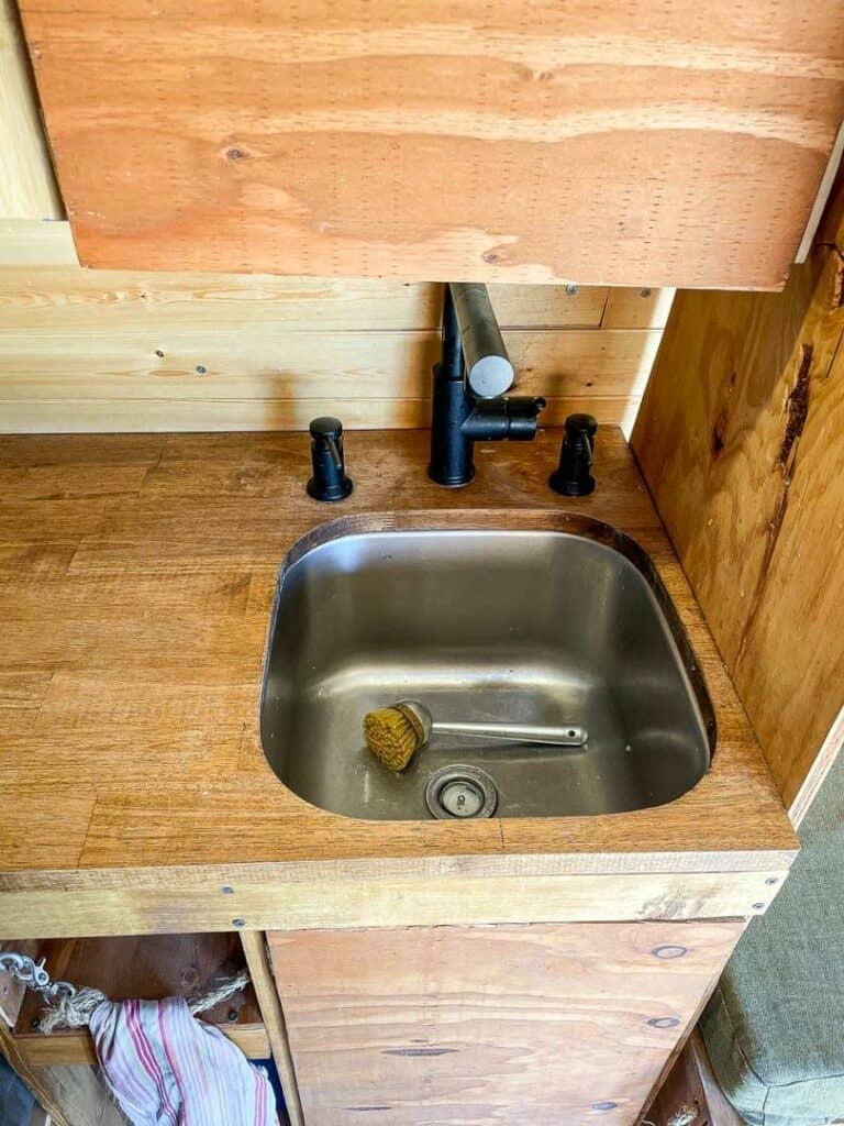 Small kitchen sink and faucet in a campervan