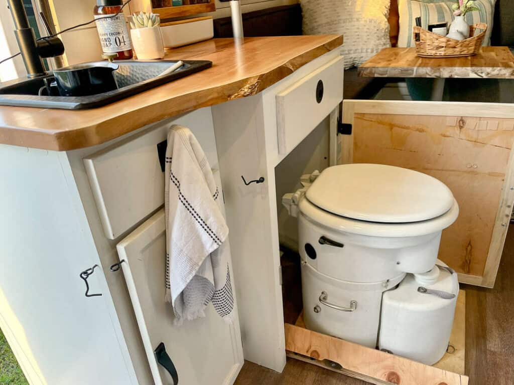 Airhead Composting toilet pulls out from one of the kitchen cabinets