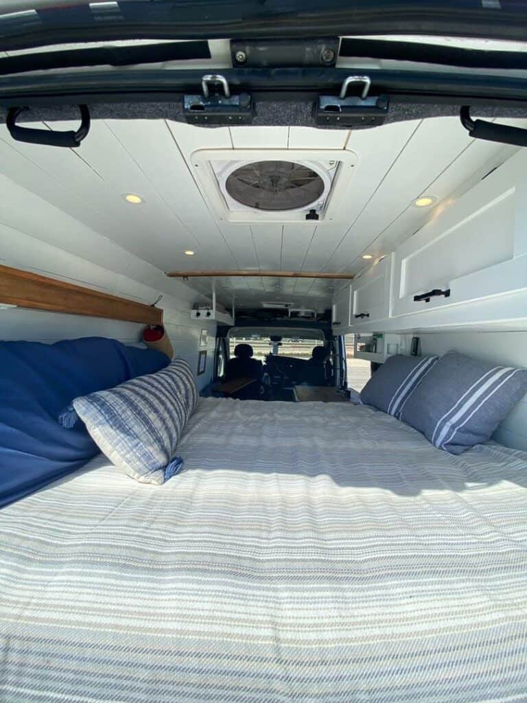 A platform bed in a camper van
