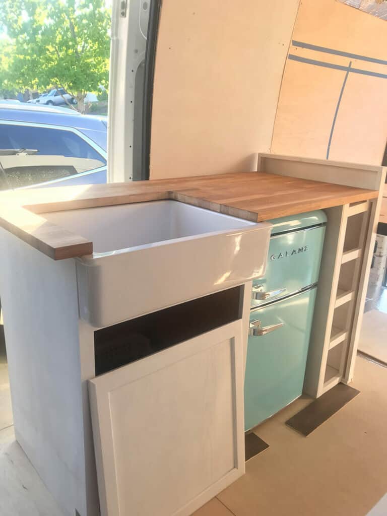 Unfinished kitchen build in a camper van