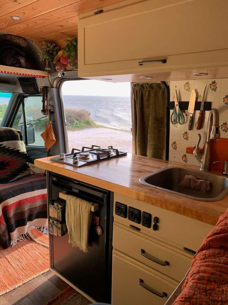 Van kitchen with ocean view outside sliding door