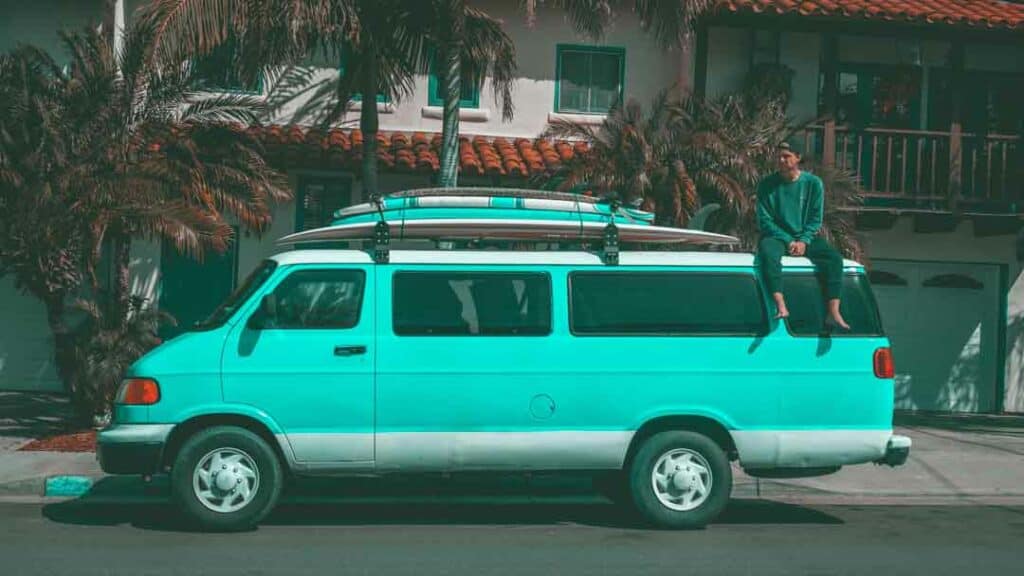 van with surfboards on top