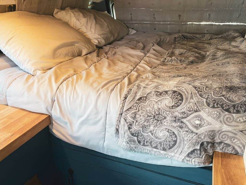 close up of a platform bed in a camper van