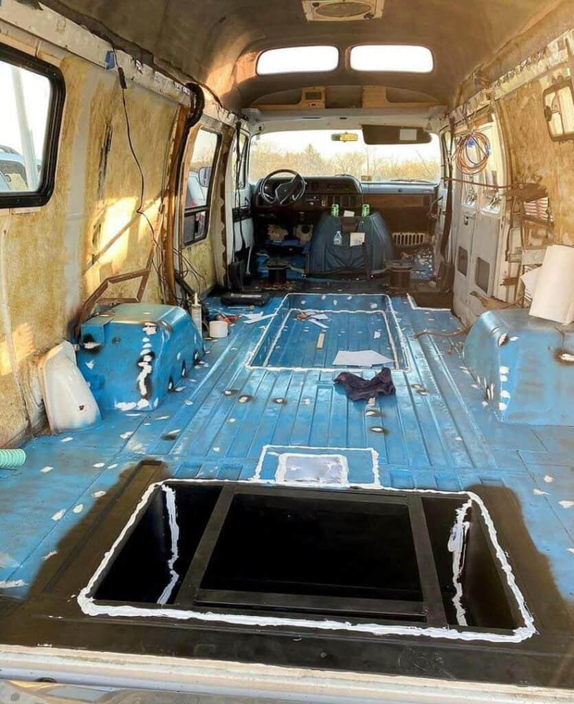 A camper van gutted to the metal sides and floor
